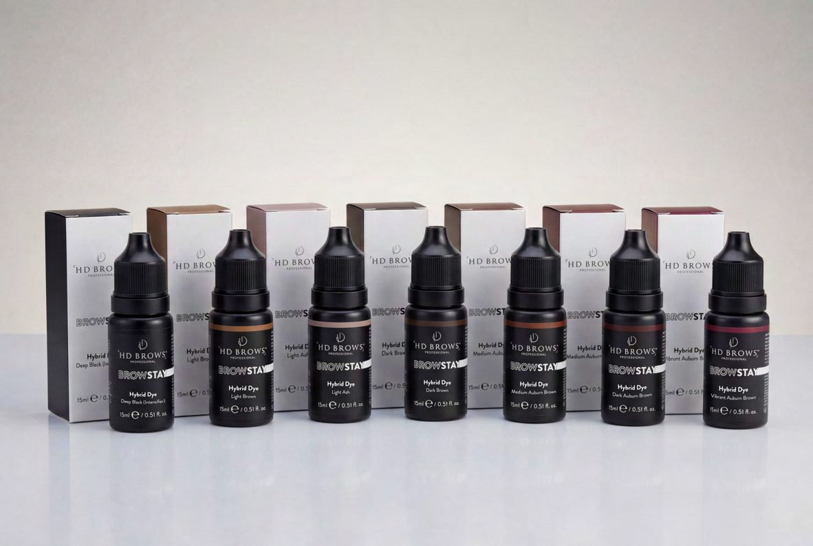 Row of black brow tint bottles in front of their cartons